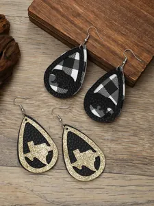 Detail view of teardrop PU leather earrings featuring Texas map and buffalo plaid bear motifs