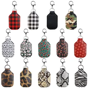Set of leather hand sanitizer bottle holders with sports and animal print keychains