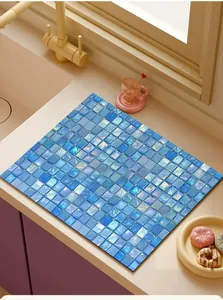 Blue mosaic pattern absorbent leather mat placed on kitchen countertop for sink drainage
