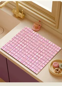 Pink mosaic pattern absorbent leather kitchen countertop mat in a modern sink setting