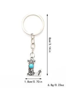 Detailed measurement view of silver letter L keychain with turquoise and Western motifs