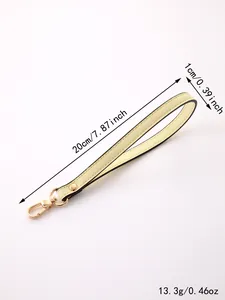 Detail view of yellow PU leather wrist strap keychain with size 20cm x 1cm measurements