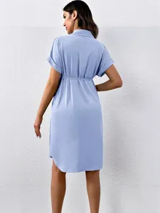 Light blue maternity shirt dress with short sleeves and nursing tie-waist feature