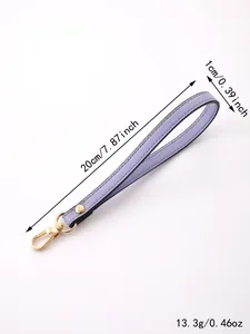 Detail view showing dimensions of a purple leather wrist strap with gold clasp