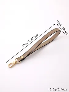 Detailed view of the 20cm khaki wristlet strap with gold-tone hardware and dimensions