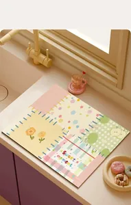 Close-up view of a vibrant cartoon absorbent kitchen mat with dopamine style patterns