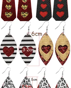 Detail of Valentine's Day faux leather earrings showing size dimensions and heart patterns.