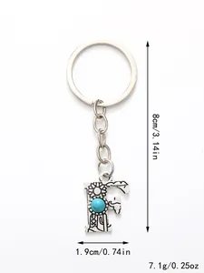 Detail view of silver alloy F-letter keychain with turquoise stone and measurements