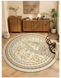 Top view of a round floral rug with vintage rose patterns in a warm and cozy living room.