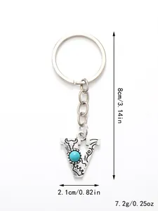 Detailed view of silver letter V keychain with turquoise inlay and dimensions