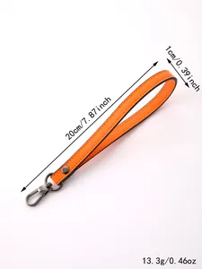 Detailed dimensions and weight of the orange leather wristlet strap with gunmetal clasp