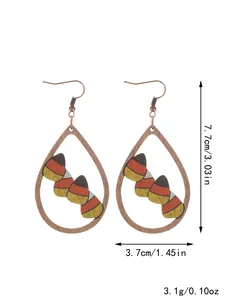 Wooden teardrop earrings featuring Halloween candy corn pattern with dimensions and weight