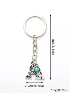 Detail view of silver-toned initial A letter keychain with turquoise stone and measurements