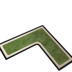 L-shaped non-slip bathroom mat in green with absorbent diatom mud texture for sinks.