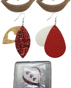 Detailed view of red glitter and heart leather earrings for Valentine's Day