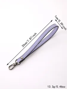 Macro view of purple faux leather wristlet strap with exact length and width markings