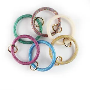 Set di portachiavi a bracciale in silicone glitterato con anelli dorati in vari colori