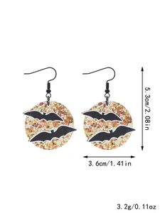 Detailed view of Halloween glitter bat drop earrings with size and weight specs