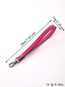 Detailed view of pink faux leather wristlet strap with dimensions 20cm by 1cm length.