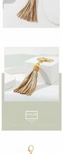 Elegante portachiavi con nappa in pelle champagne e moschettone dorato per borsa