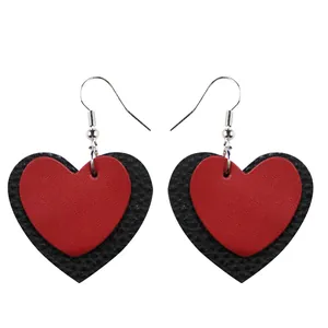 Double layered red and black heart leather earrings with silver fishhook wires.