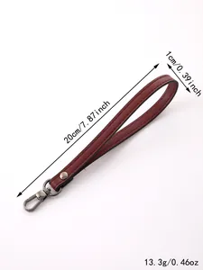 Detailed view of the wine red leather wrist strap with 20cm length and metal clasp