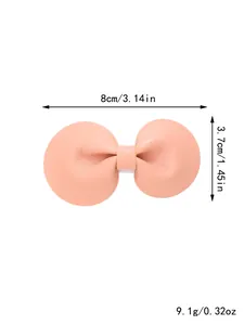 Afmetingen en gewichtsspecificaties voor de roze lederen strik haarspeld accessoire.