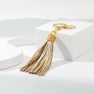 Elegant beige leather tassel keychain with gold lobster clasp for car and bag charms