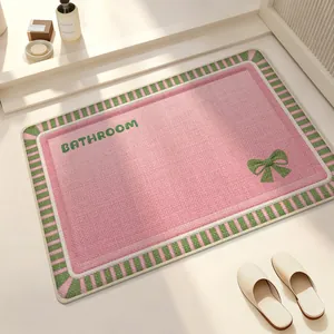 Elegant pink and green linen woven absorbent bathroom mat with a charming bow design