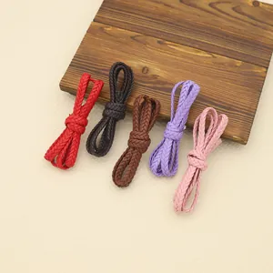 Macro view of colorful 3-strand PU braided leather ropes for DIY accessory projects