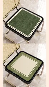 Close-up detail of vintage linen-style chair cushions with two elegant pattern designs