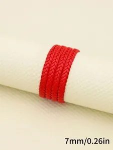 Close-up detail of 7mm red braided PU leather cord with fine three-strand weave texture