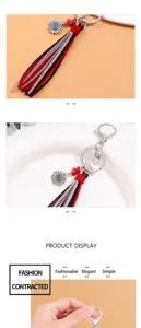 Detail view of suede tassel keychain with retro sunflower charm and red beads decoration