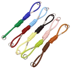 Correas de muñeca de cuero PU trenzado de colores en varios tonos para bolsos y móviles