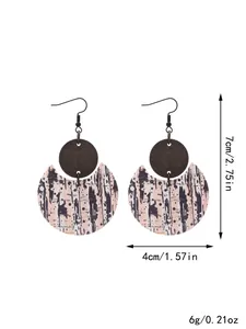 Crescent drop earrings made of leather and wood, showing dimensions 7x4cm and weight