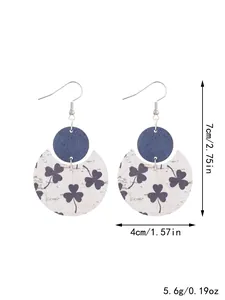 Detailed view of crescent leather earrings featuring clover patterns and sizing measurements.
