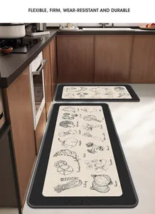 Detail view of L-shaped kitchen mats with vegetable prints in a modern kitchen setting