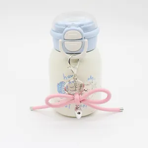 Close-up of a stylish pink leather cord bow keychain featuring a silver heart charm.