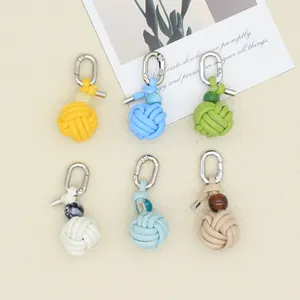 Six colorful hand-woven PU leather ball charms with metal clasps for bags and shoes decoration