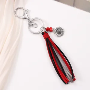 Retro sunflower keychain with red and black suede tassel and silver lobster clasp