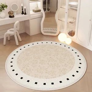 Tapis rond minimaliste couleur crème avec bordure carrée noire pour salon et chambre