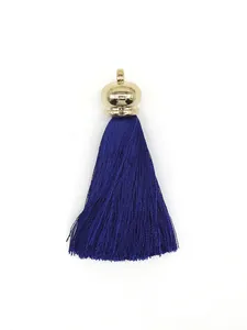 Detail of a royal blue polyester tassel with a gold-toned crown cap for DIY crafts.
