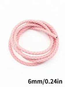 Detailed macro view of pink 6mm braided PU leather cord for craft and accessory making