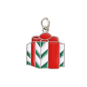 Detailed macro view of a festive red and green enamel Christmas gift box pendant charm