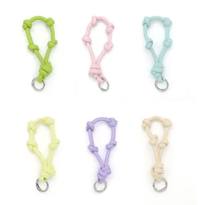 Six varieties of premium leather knotted keychain lanyards in pastel colors on white background