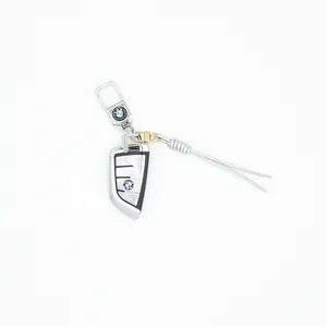 Close-up of a silver braided leather keychain with a stylish car key fob accessory