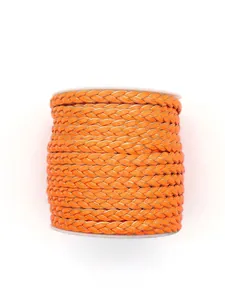 Close-up of vibrant orange three-strand braided PU leather cord on a white spool.