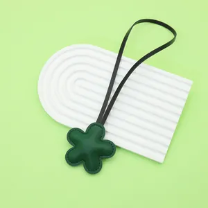 Stylish green leather flower bag charm with delicate stitching for cute car decor