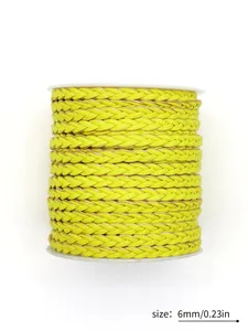 Close-up detail of 6mm neon yellow braided PU leather cord with three-strand texture