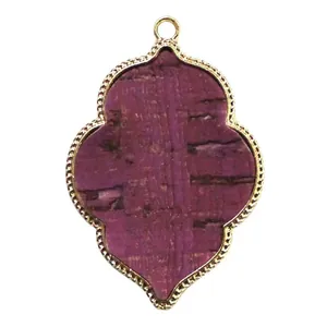 Detailed view of purple bark texture pendant with golden alloy quatrefoil frame